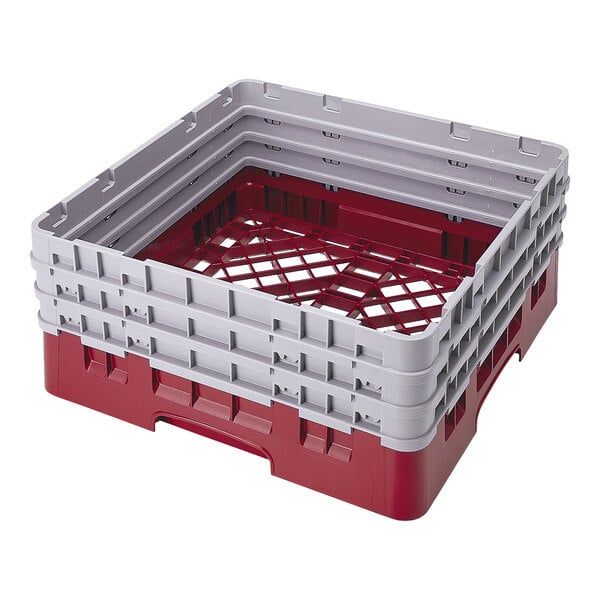A cranberry and gray full size plastic base rack with closed sides and three extenders, designed for dishwashing and storage.