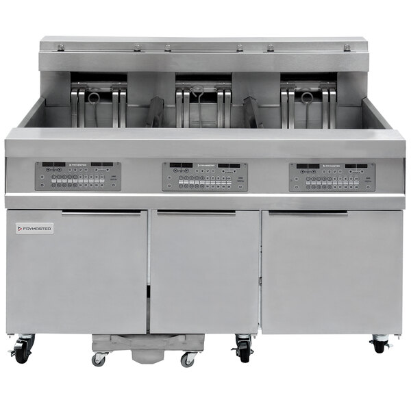 A Frymaster electric floor fryer with three drawers and two baskets.