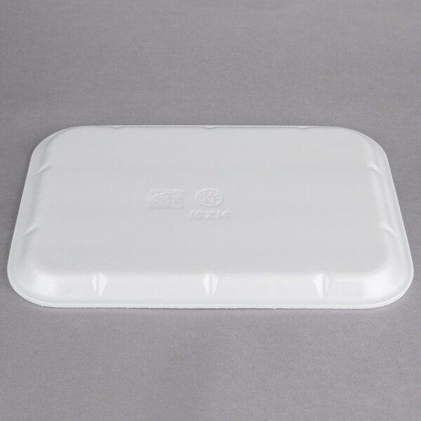 A white foam CKF school tray with text on it.