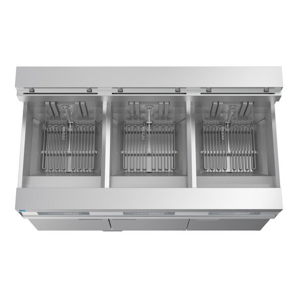 A commercial electric floor fryer with three separate oil tanks and integrated filtration system.
