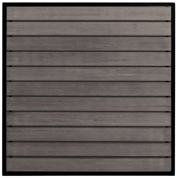 A close-up of a gray synthetic teak wood panel with black lines.