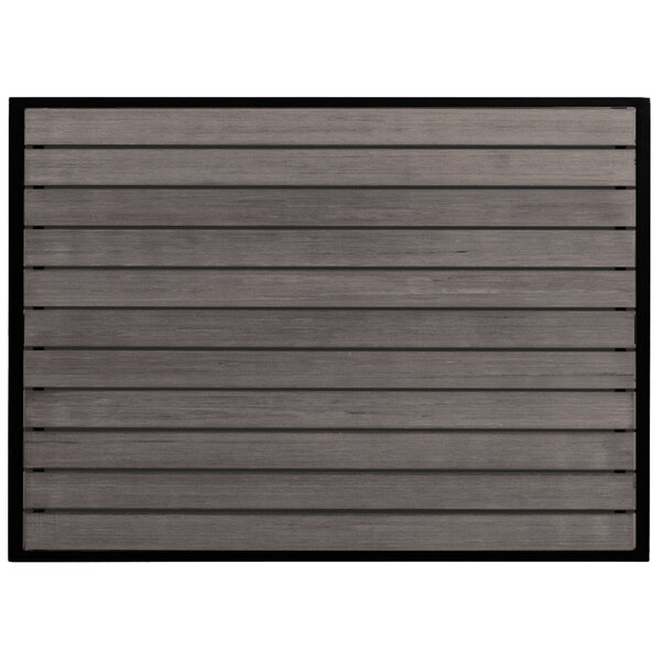 A BFM Seating outdoor table with a gray synthetic teak top.