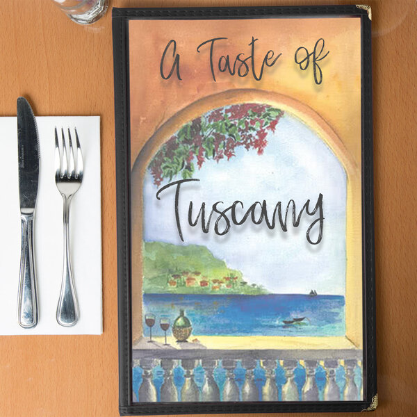 A Mediterranean themed menu cover with a picture of a villa and water view on a table.