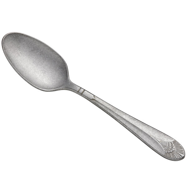 a silver spoon on a white background
