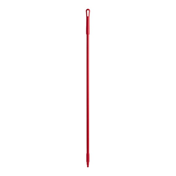 A red plastic Carlisle Sparta broom/squeegee handle with threaded ends.