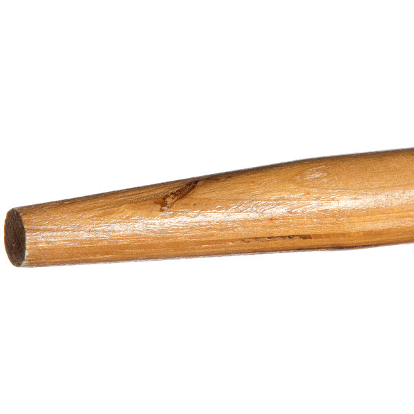 A Carlisle wood broom/squeegee handle with a tapered end.