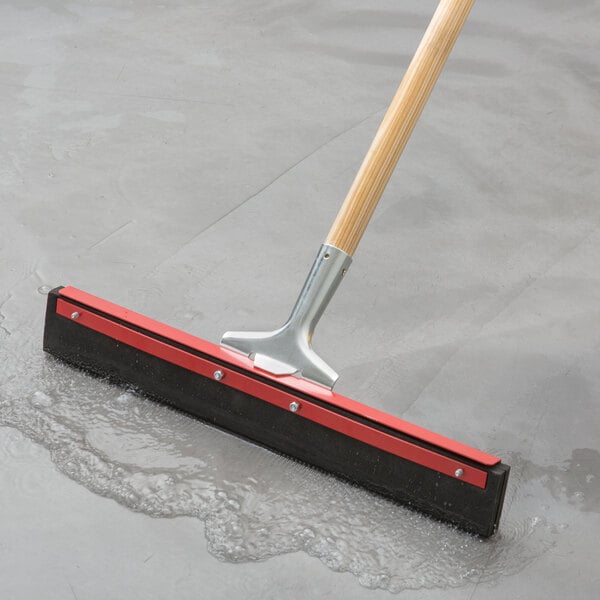 Red double neoprene foam floor squeegee cleaning up water