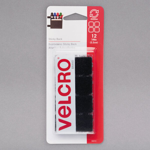 A package of 12 black Velcro® adhesive squares.