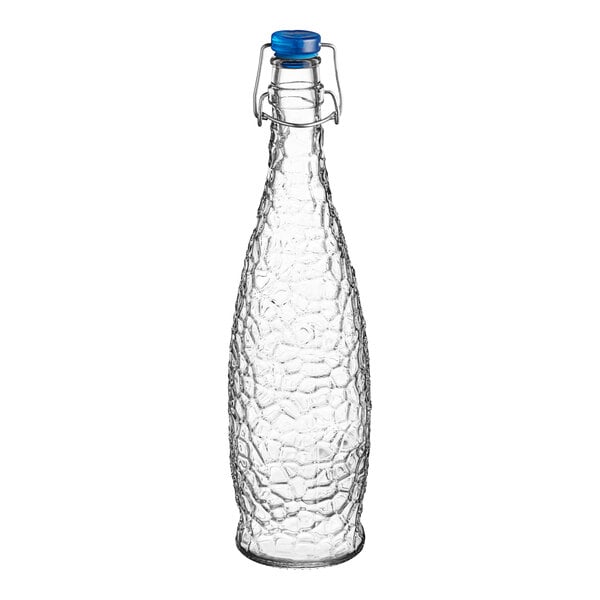 A clear glass bottle with a blue wire bail lid.