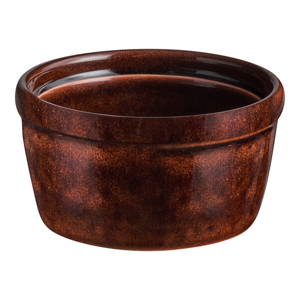 A brown porcelain ramekin with a glossy finish.