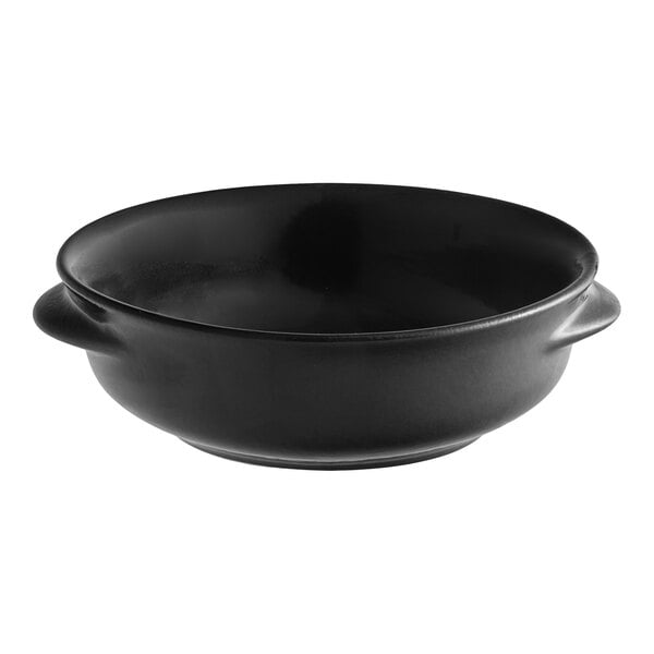 A black porcelain onion soup crock with two side handles.
