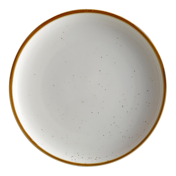 An Acopa Keystone vanilla bean stoneware coupe plate with brown specks.