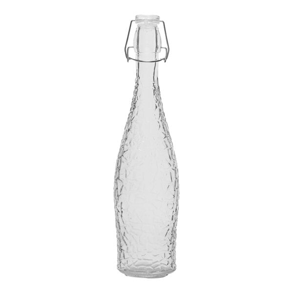 A clear glass bottle with a clear wire bail lid.