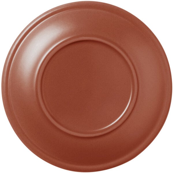 A close-up of a Libbey Driftstone clay saucer with a circular rim in brown.