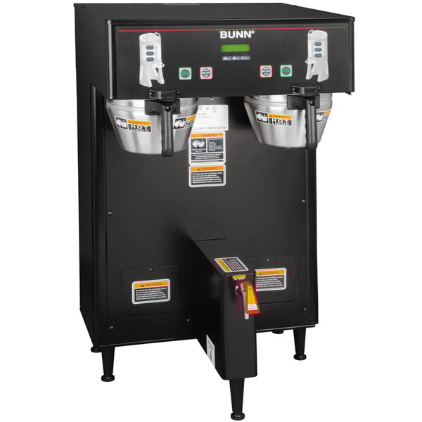 A black Bunn BrewWISE commercial coffee machine with two silver cups on top.