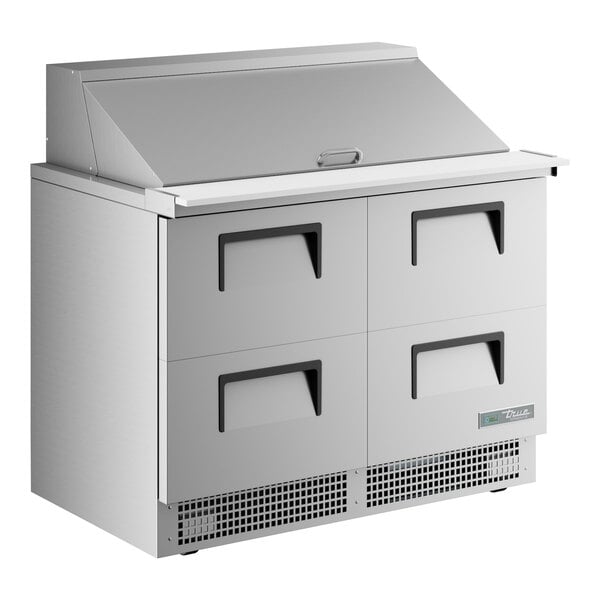 A stainless steel True Mega Top Refrigerated Sandwich Prep Table with 4 drawers.