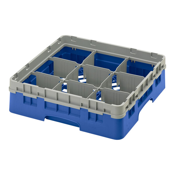 A blue plastic Cambro glass rack with 9 compartments.