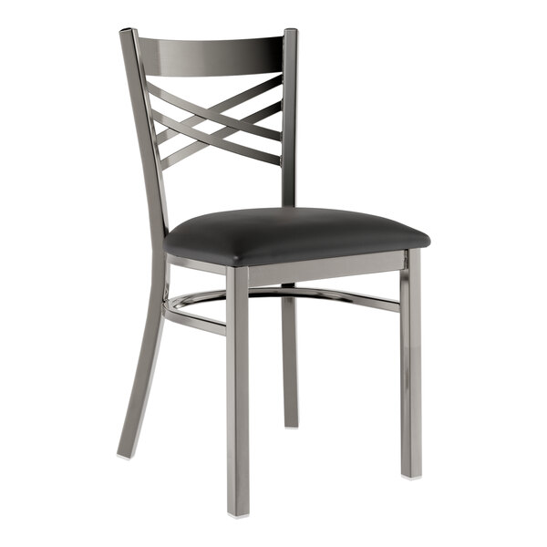 A standard height dining chair with a clear coat steel cross back and a padded black seat.