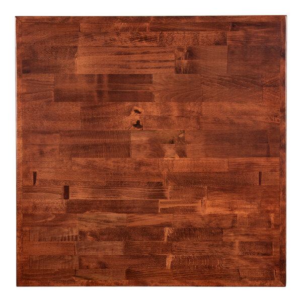 A close up of a Lancaster Table & Seating mahogany butcher block table top.