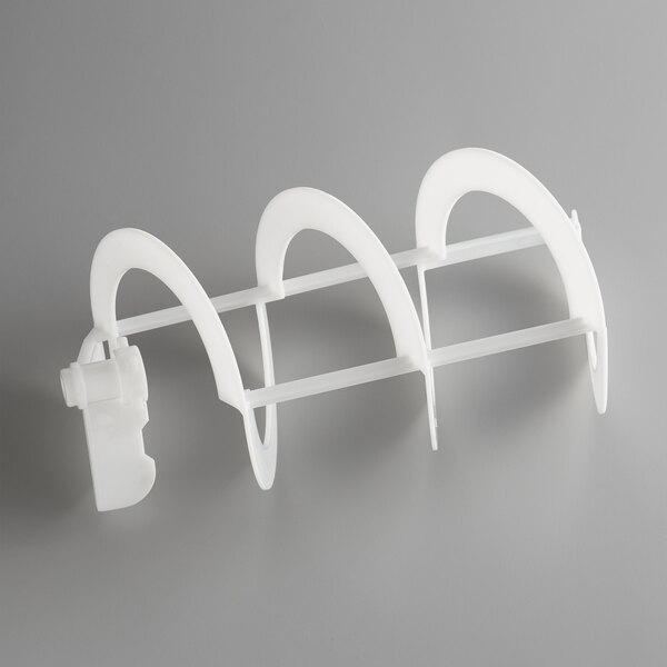 A close-up of a white plastic Narvon auger blade with a clip on it.