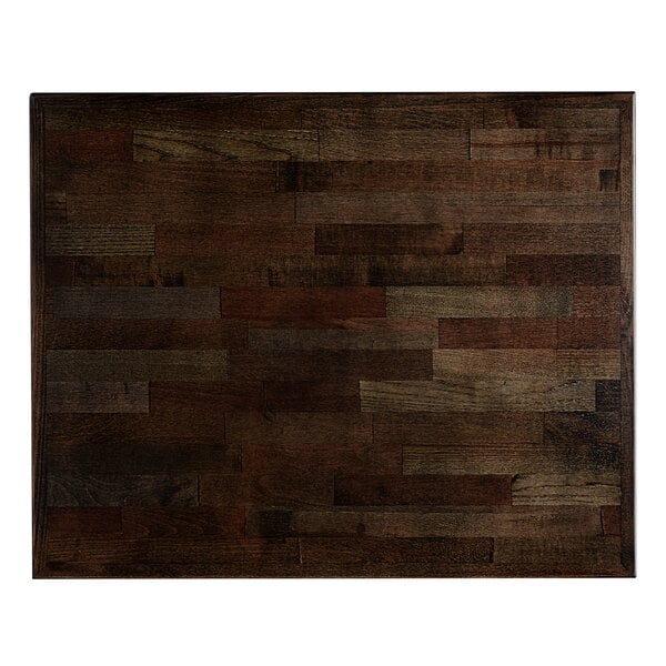 A wooden table top with an espresso finish on a Lancaster Table & Seating table with a cast iron base.