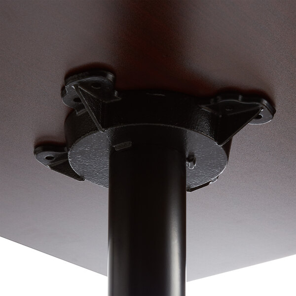 A black table top with a metal base on a Lancaster Table.