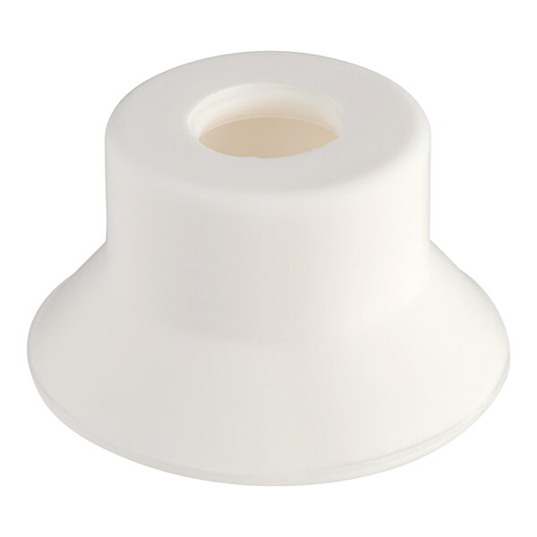 A white plastic auger blade seal with a hole in the middle.
