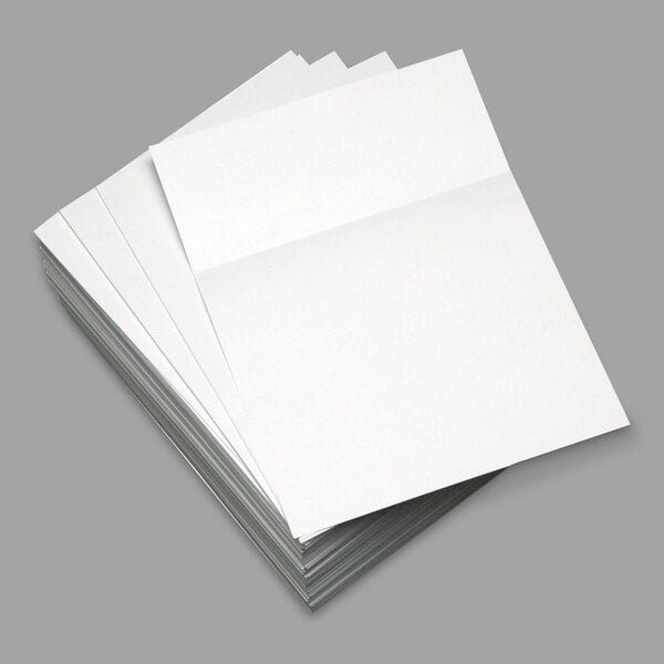 A stack of Domtar white custom cut-sheet paper.