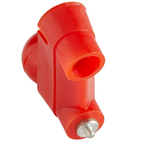 A red plastic pipe with a metal end and a hole.