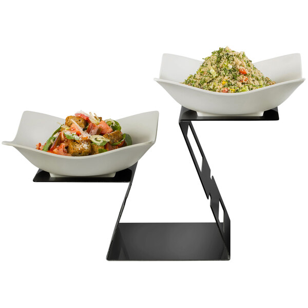 A Rosseto black matte riser with two bowls of food on a table.