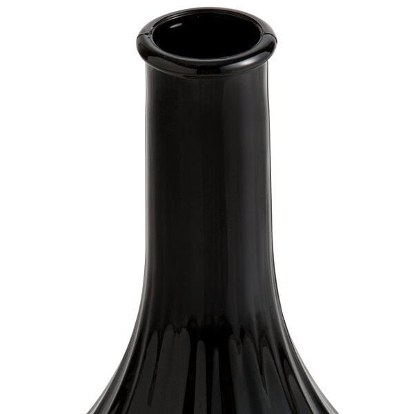 a black bottle with a red cap