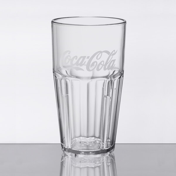 A close up of a clear GET Bahama plastic tumbler with a Coca-Cola logo.