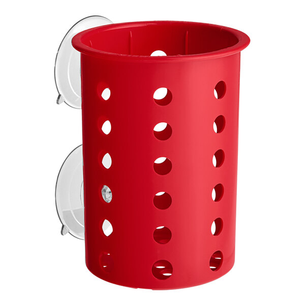 A red Steril-Sil plastic flatware cylinder with holes.