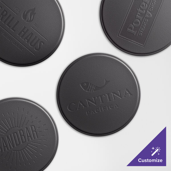 Four black H. Risch, Inc. customizable circular coasters with the word "canna" on them.