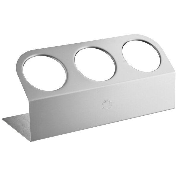 a silver object with four holes