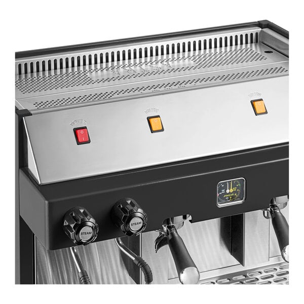 An Astra Mega II M2S-017 semi-automatic stainless steel espresso machine with control knobs and indicator lights.