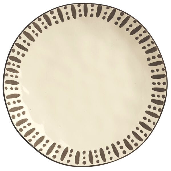 A white Libbey stoneware dinner plate with black dots.