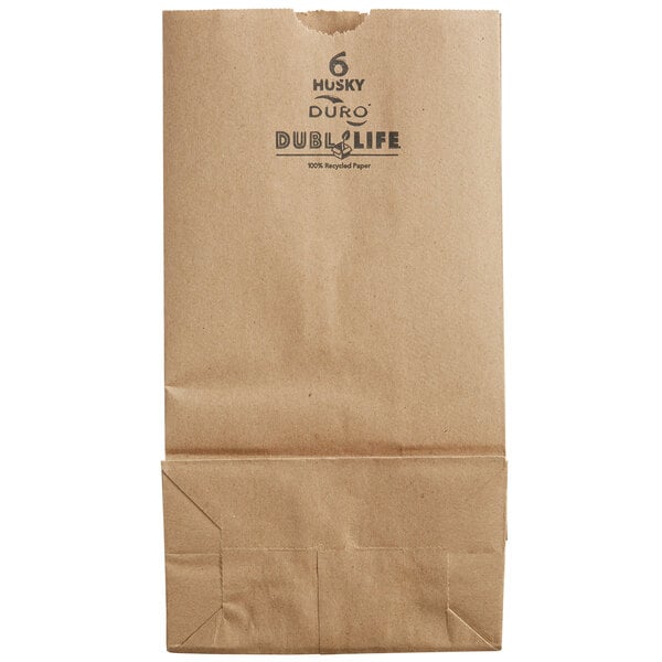A brown Duro paper bag with black text that reads "Husky Dubl Life"
