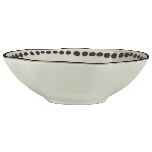 A white stoneware bowl with black trim.