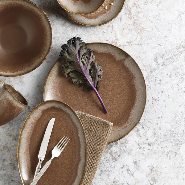 A table set with Libbey Hedonite porcelain plates, bowls, and utensils.