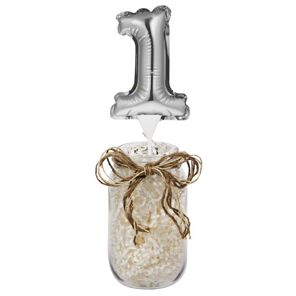 A silver balloon with the number one on it.