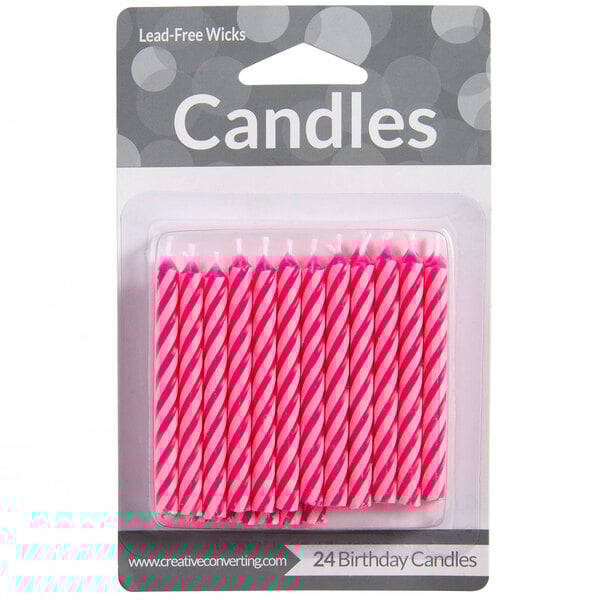 A pack of pink and white spiral candles.