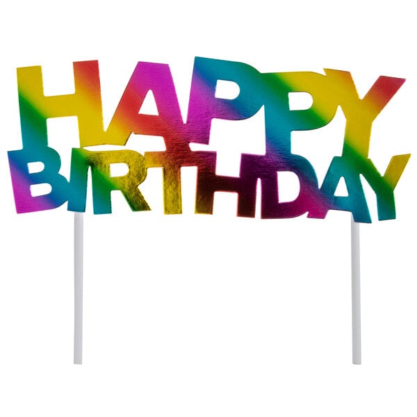 A rainbow "Happy Birthday" cake topper with a colorful sign.