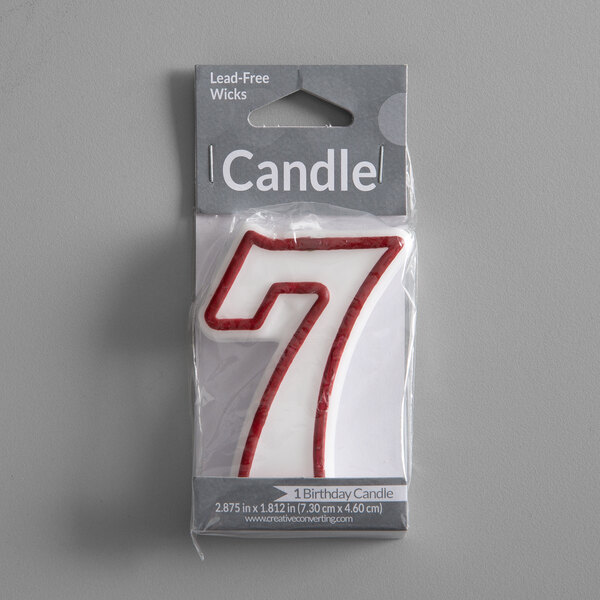 a red and white candle in a package