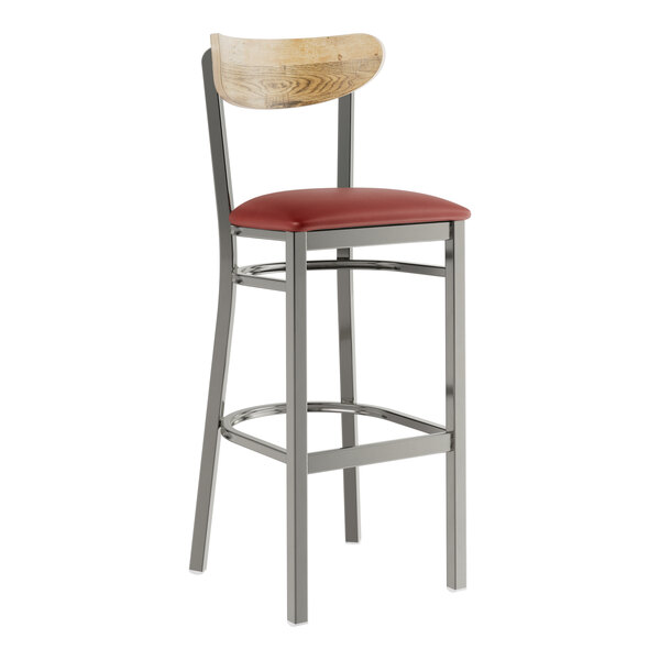A Lancaster Table & Seating bar stool with a burgundy vinyl cushion and driftwood back.