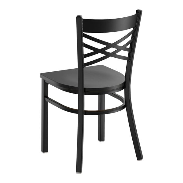 A black metal chair with a cross back design and a black wood seat.