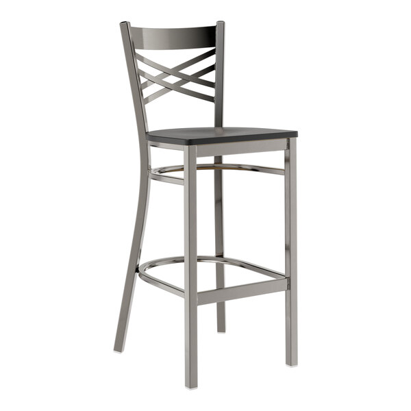 A Lancaster Table & Seating metal cross back bar stool with a black wood seat.