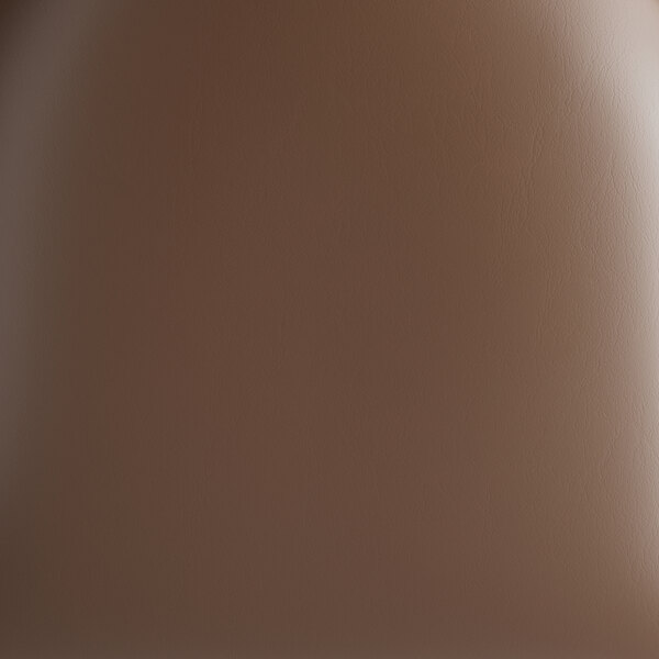 A close-up view of a dark brown vinyl seat on a bar stool.