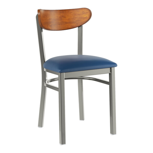 A Lancaster Table & Seating Boomerang chair with a blue vinyl seat and wood back.