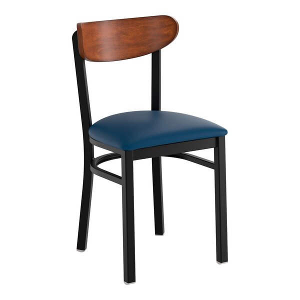 A black metal chair with a navy vinyl seat and an antique walnut wood backrest.